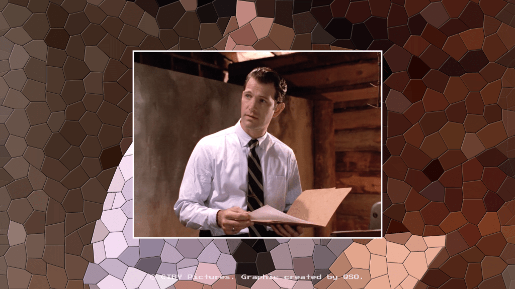 A still from Twin Peaks: Fire Walk With Me, showing FBI agent Chet Desmond. He wears a plain white suit and a tie, and appears to be holding an open book. The background is a mosaic pattern with the same colours as the central image.