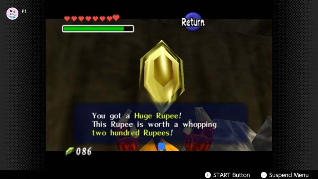 The Gold Ruppee in the Legend of Zelda. Link is holding it up while a textbox reads you got a huge ruppee! This ruppee is worth a whopping two hundred ruppees!